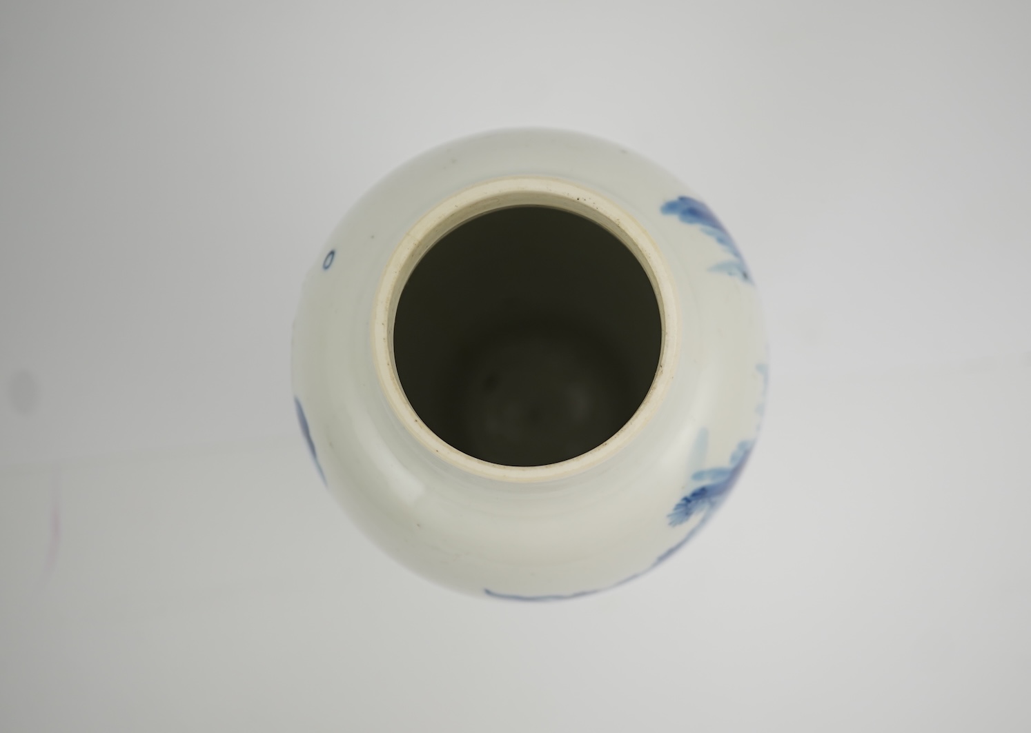 A Chinese blue and white baluster vase, early Kangxi, and associated cover